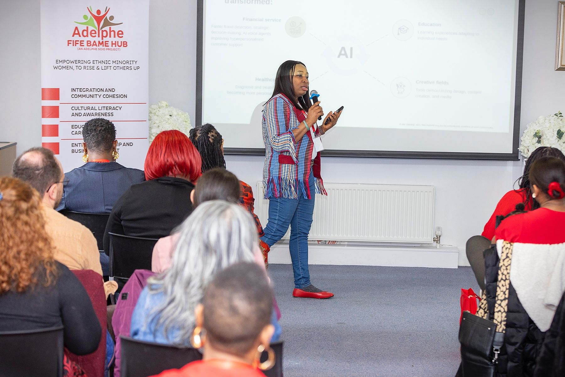 Abi Odedeyi speaking on AI to a full room at an Adelphe Fife BAME Hub event